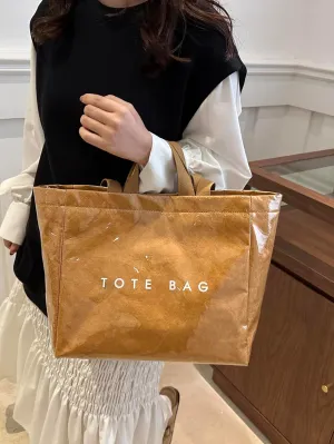 Lushandy PVC Shoulder Bag Kraft Paper Tote Bag for Women Letter Print Tote Handbag Clear PVC Viral Bag For Shopping Travel