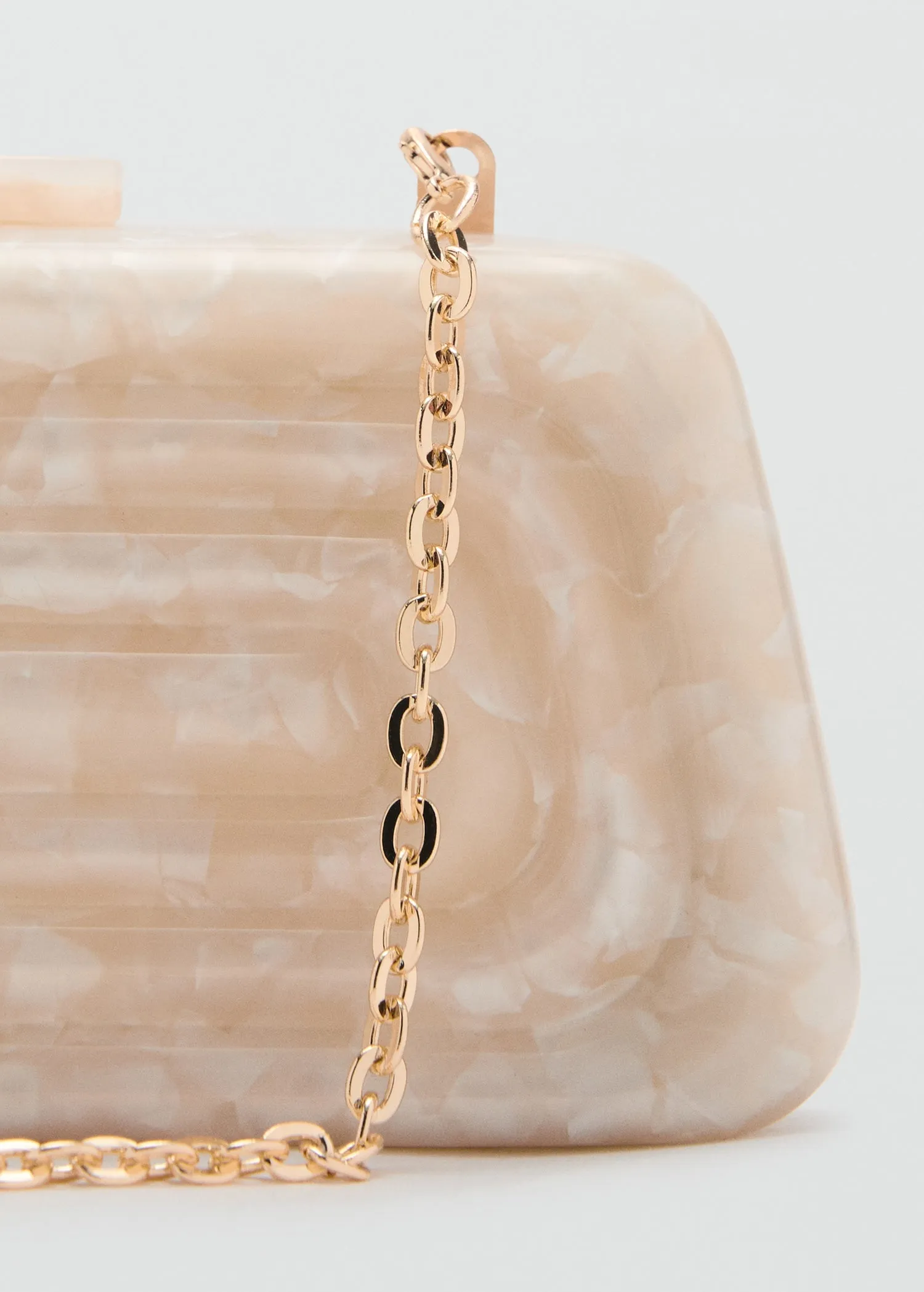 Pearl-effect clutch bag